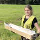 Astrid Kviseth carrying the sword away from the site.